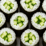 close-up photo of multiple sushi rolls (maki)