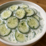 Cucumber Yogurt Salad in wood surface